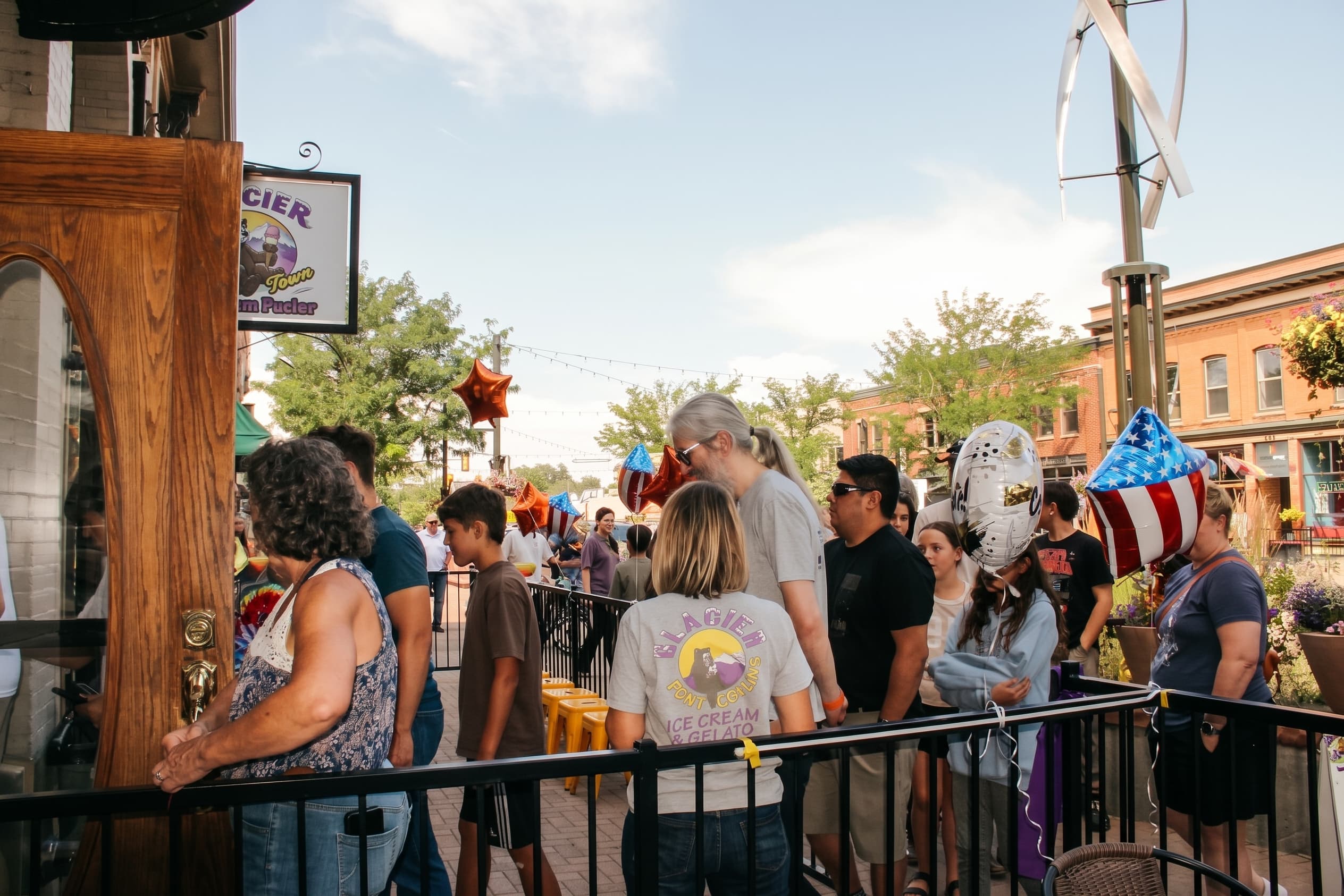 The patio and Old Town street buzzing under a blue Colorado sky