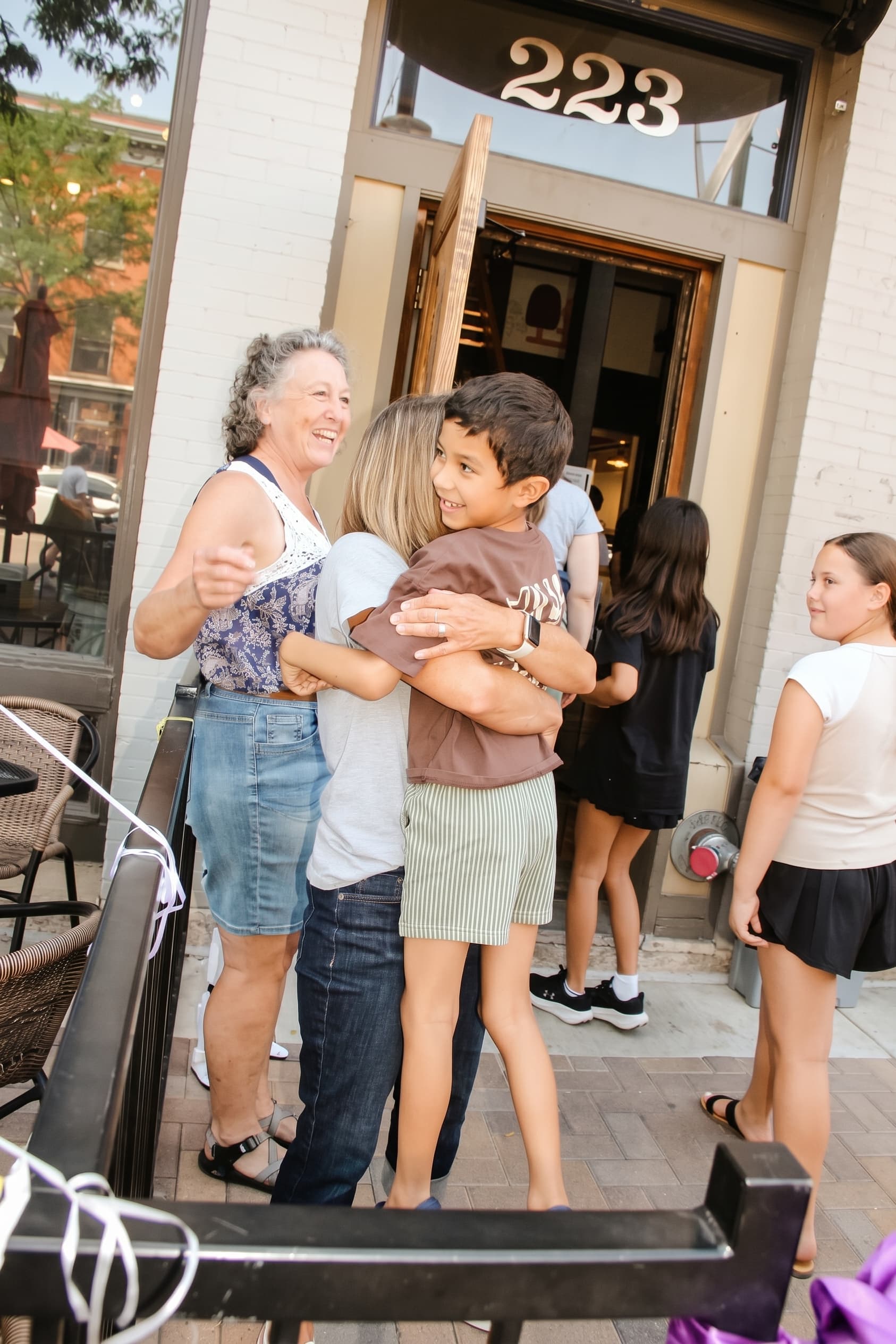 Hugs at the front door as guests arrive