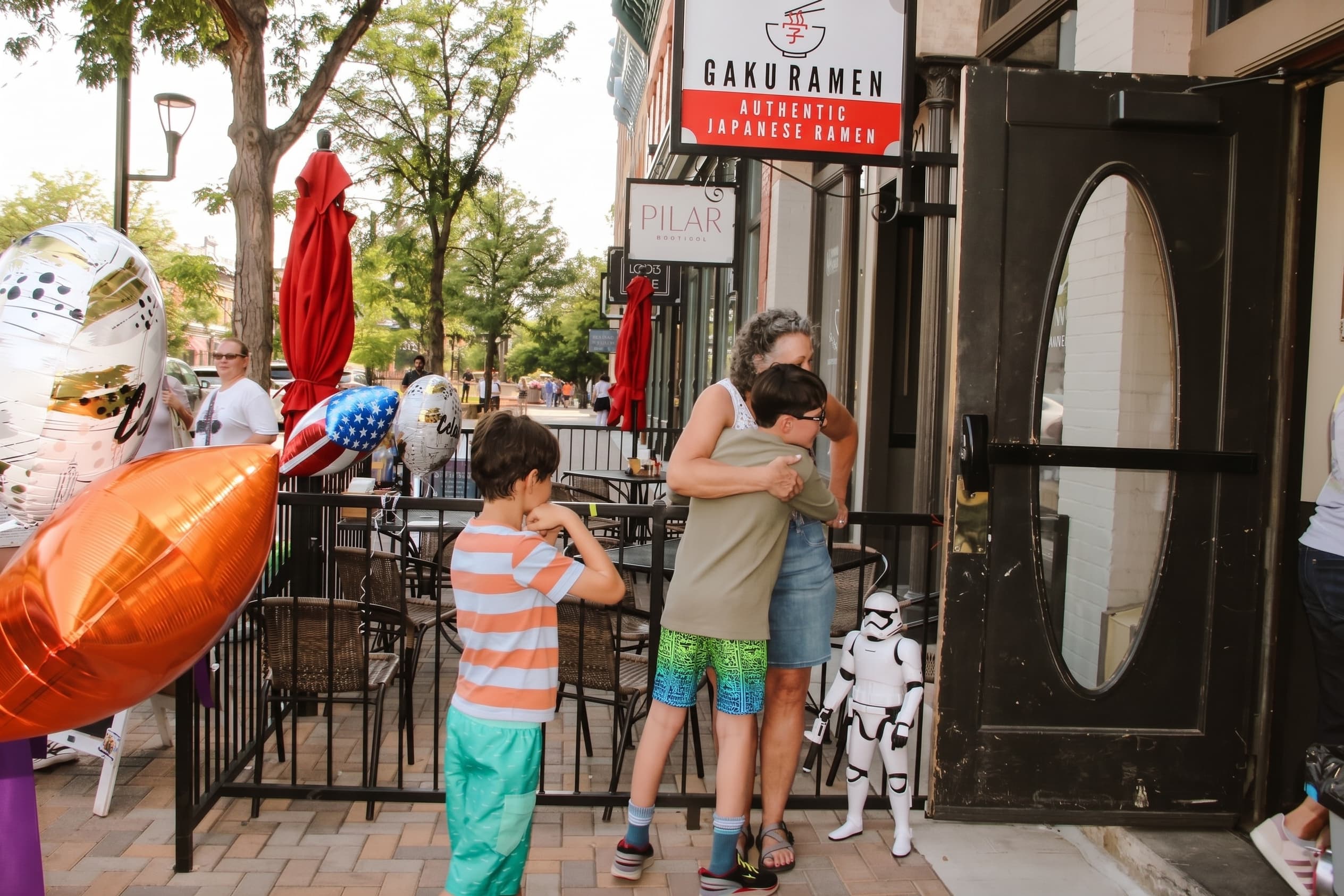 A Stormtrooper greeting kids on the patio