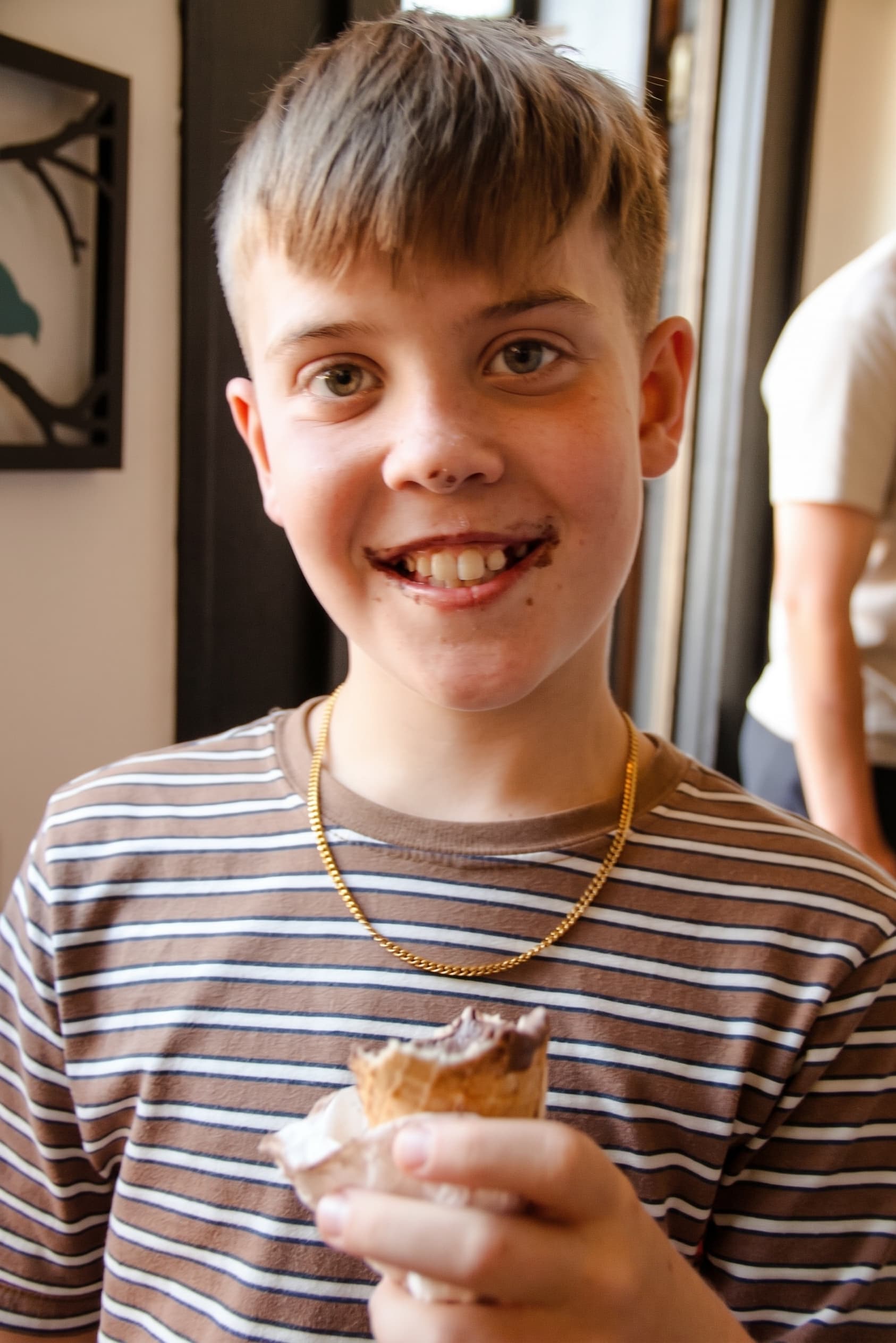 A big grin mid-cone at the counter