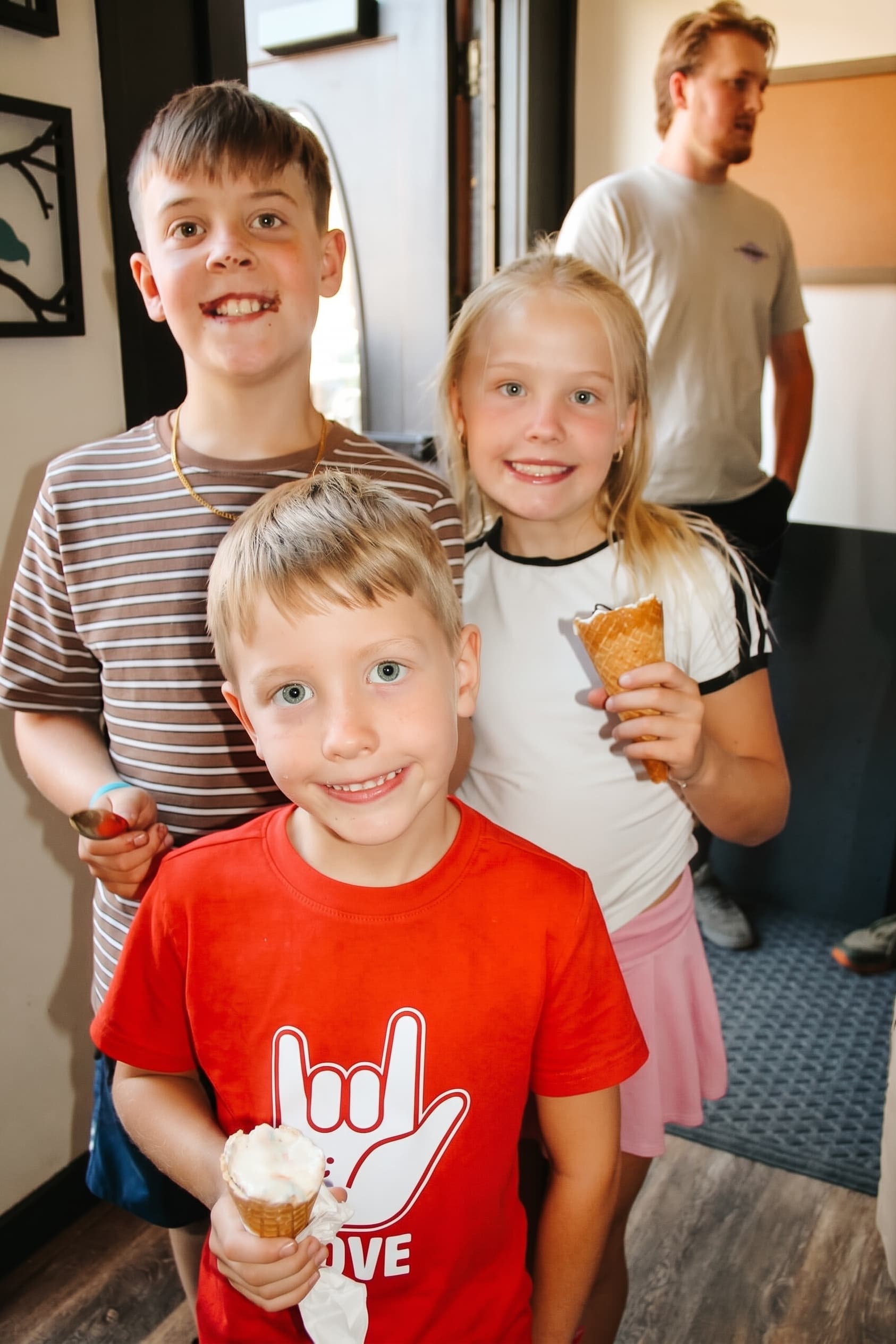 Three kids with cones and rock-and-roll spirit