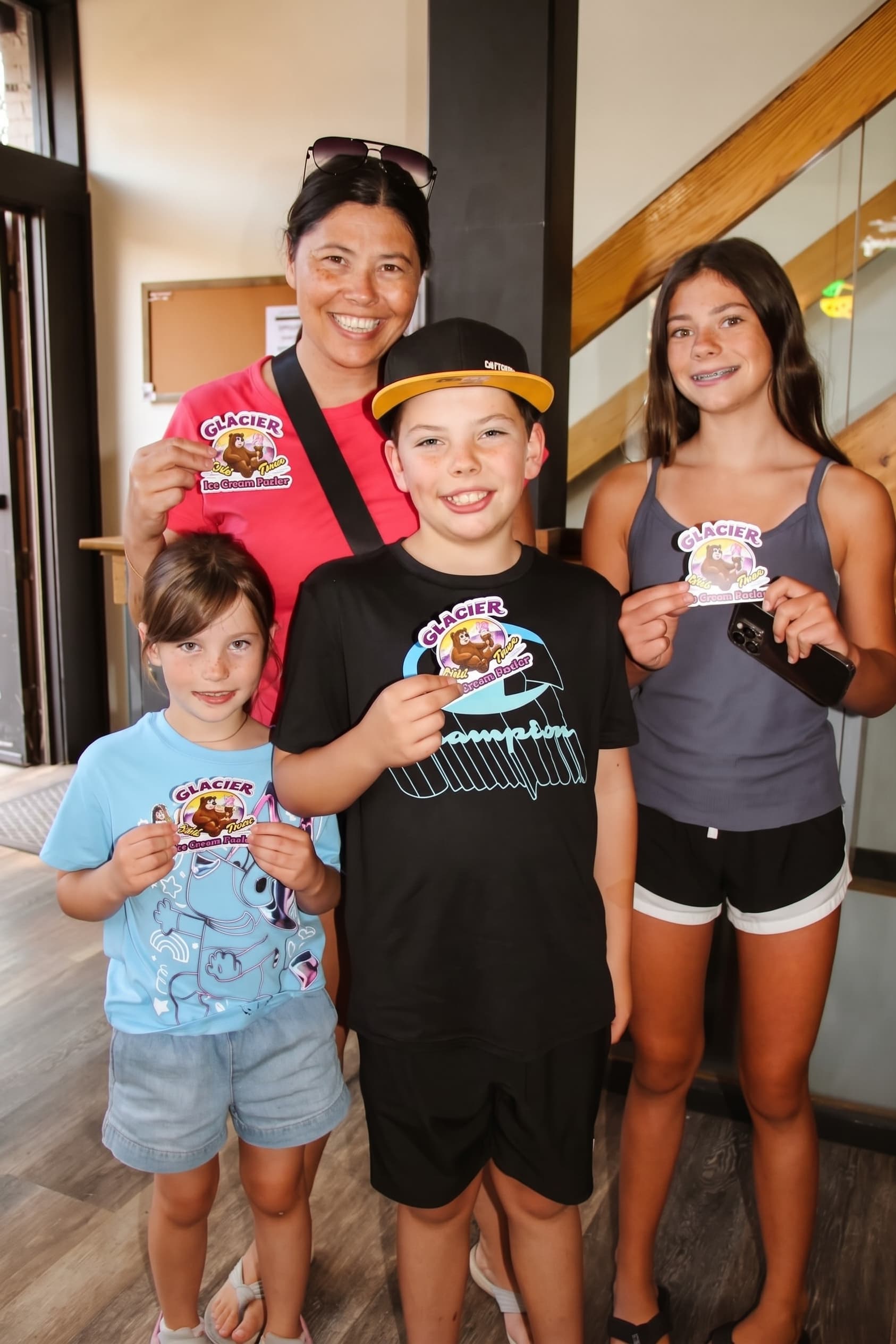 A family showing off their Glacier cards and cones