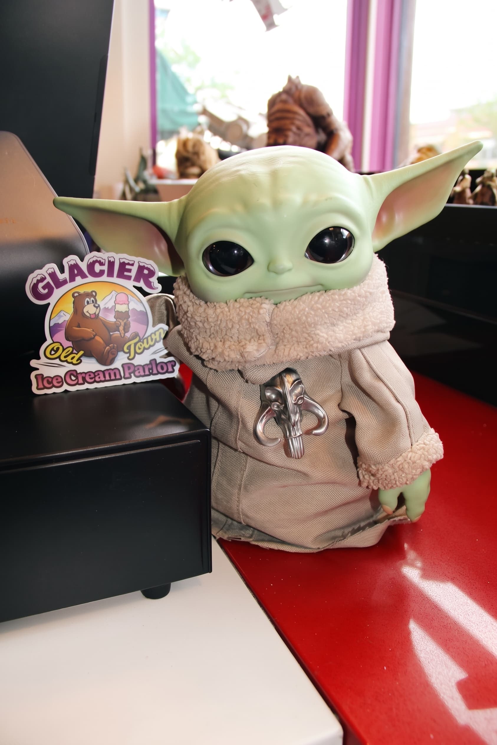 The Grogu plush keeping watch over the parlor