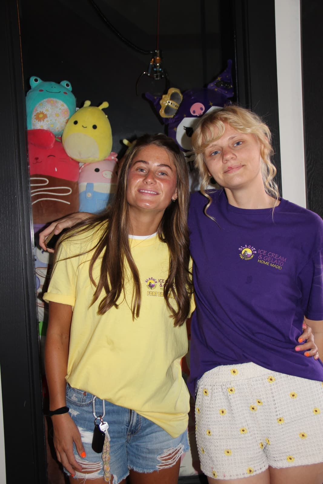 Crew members by the Squishmallow window display