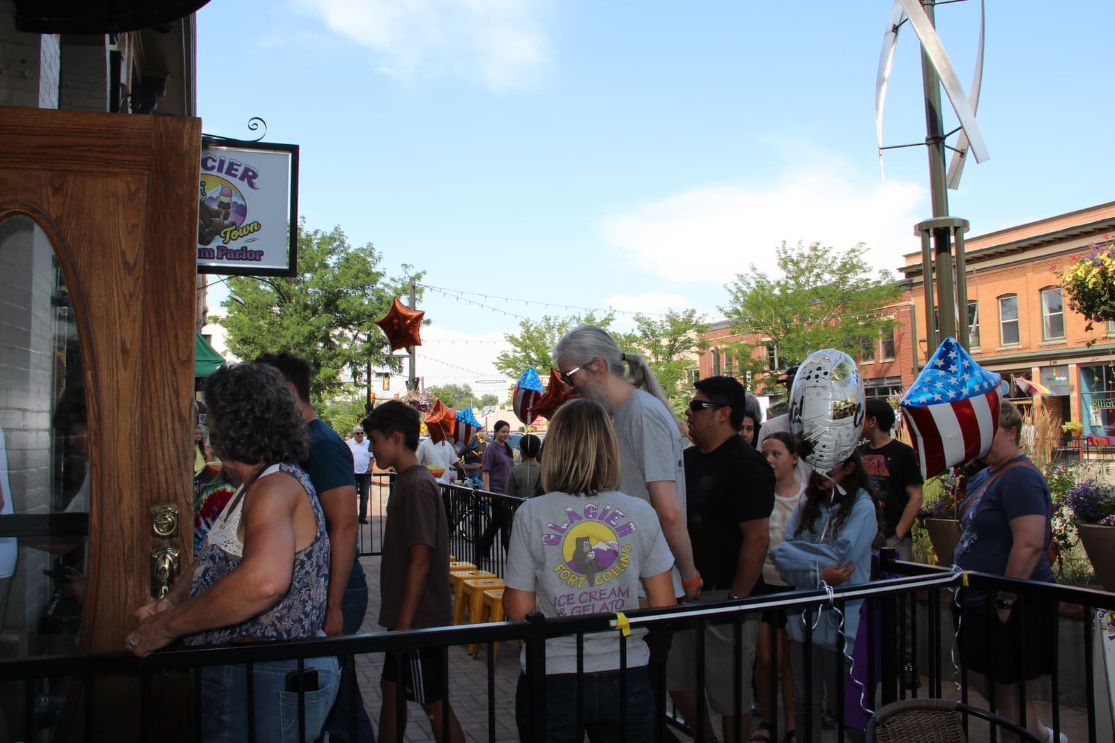 The patio and Old Town street buzzing under a blue Colorado sky