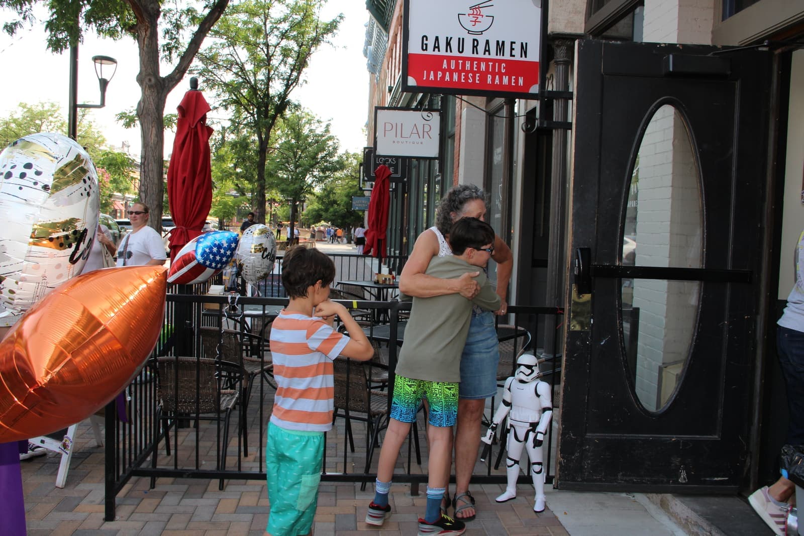 A Stormtrooper greeting kids on the patio
