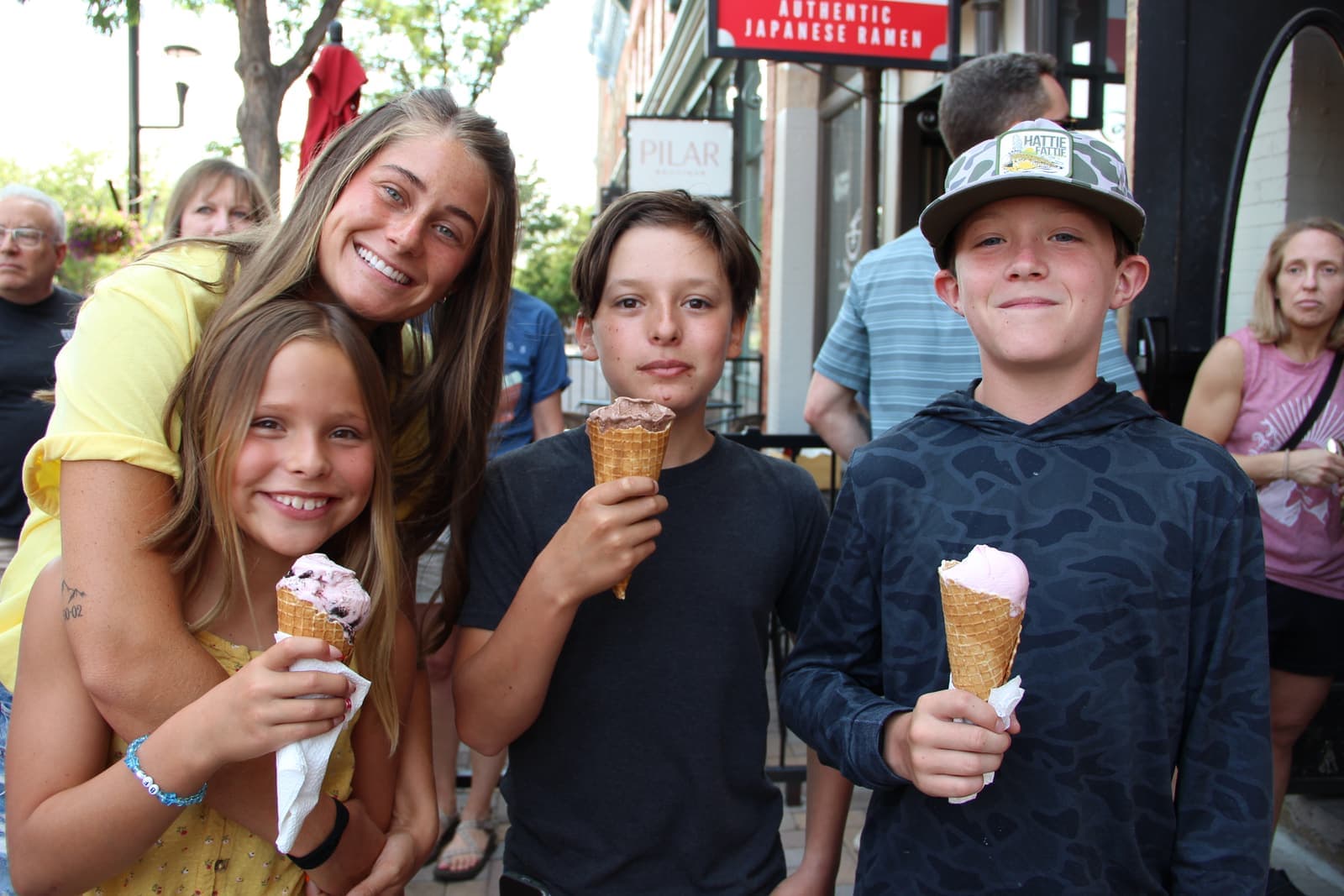 Kids showing off their first cones from the new shop