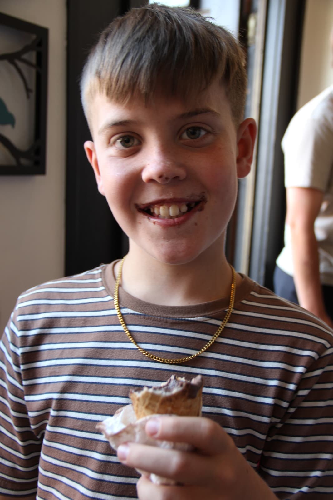 A big grin mid-cone at the counter