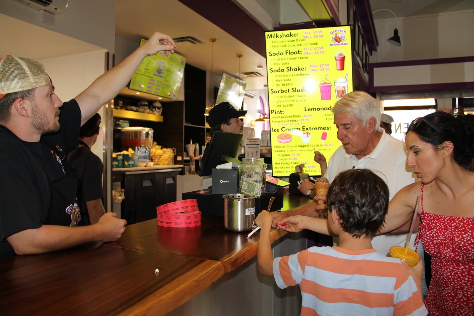 The crew serving a steady line at the counter