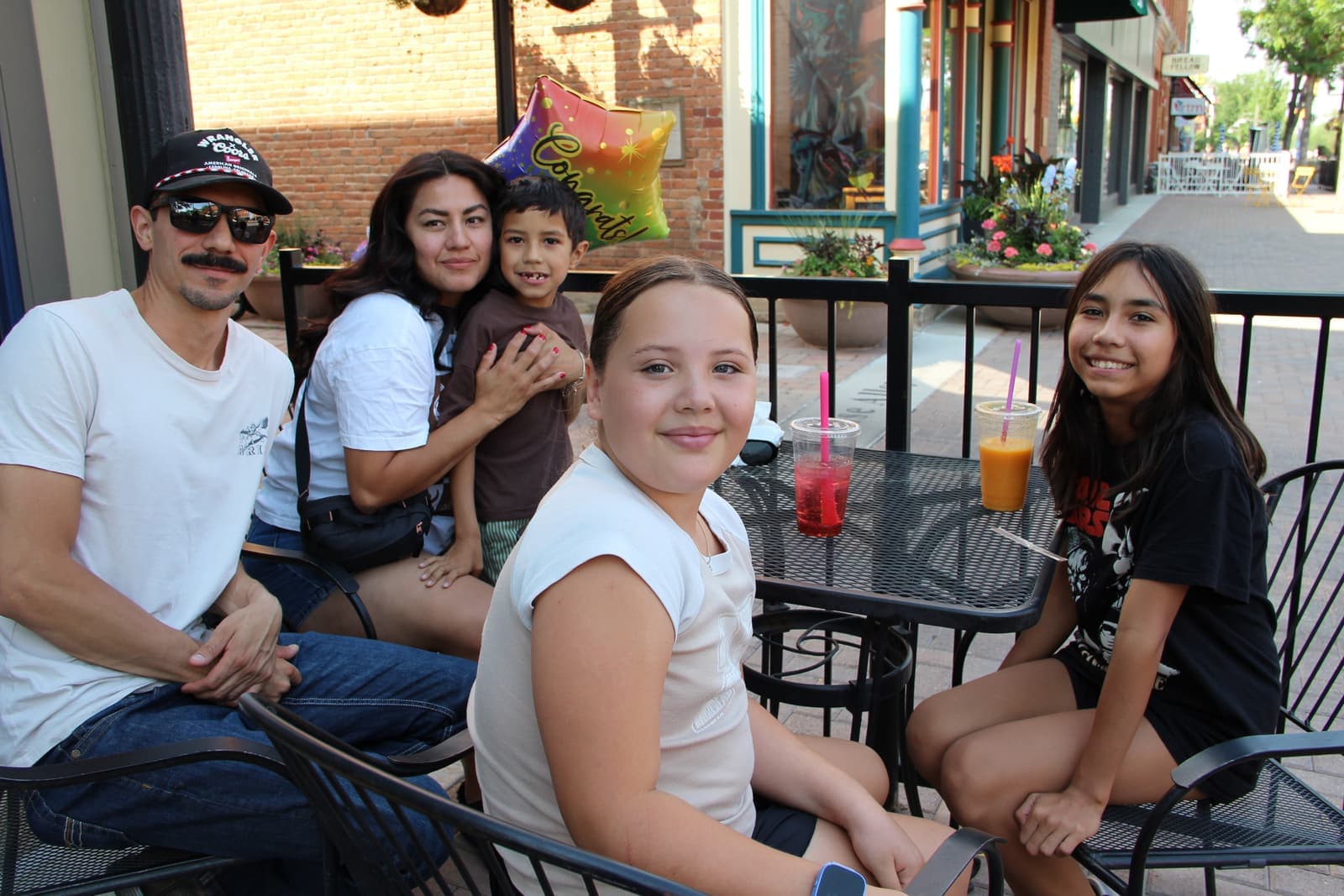 Guests relaxing at the patio tables