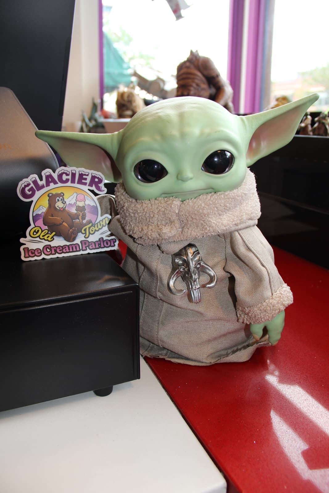 The Grogu plush keeping watch over the parlor