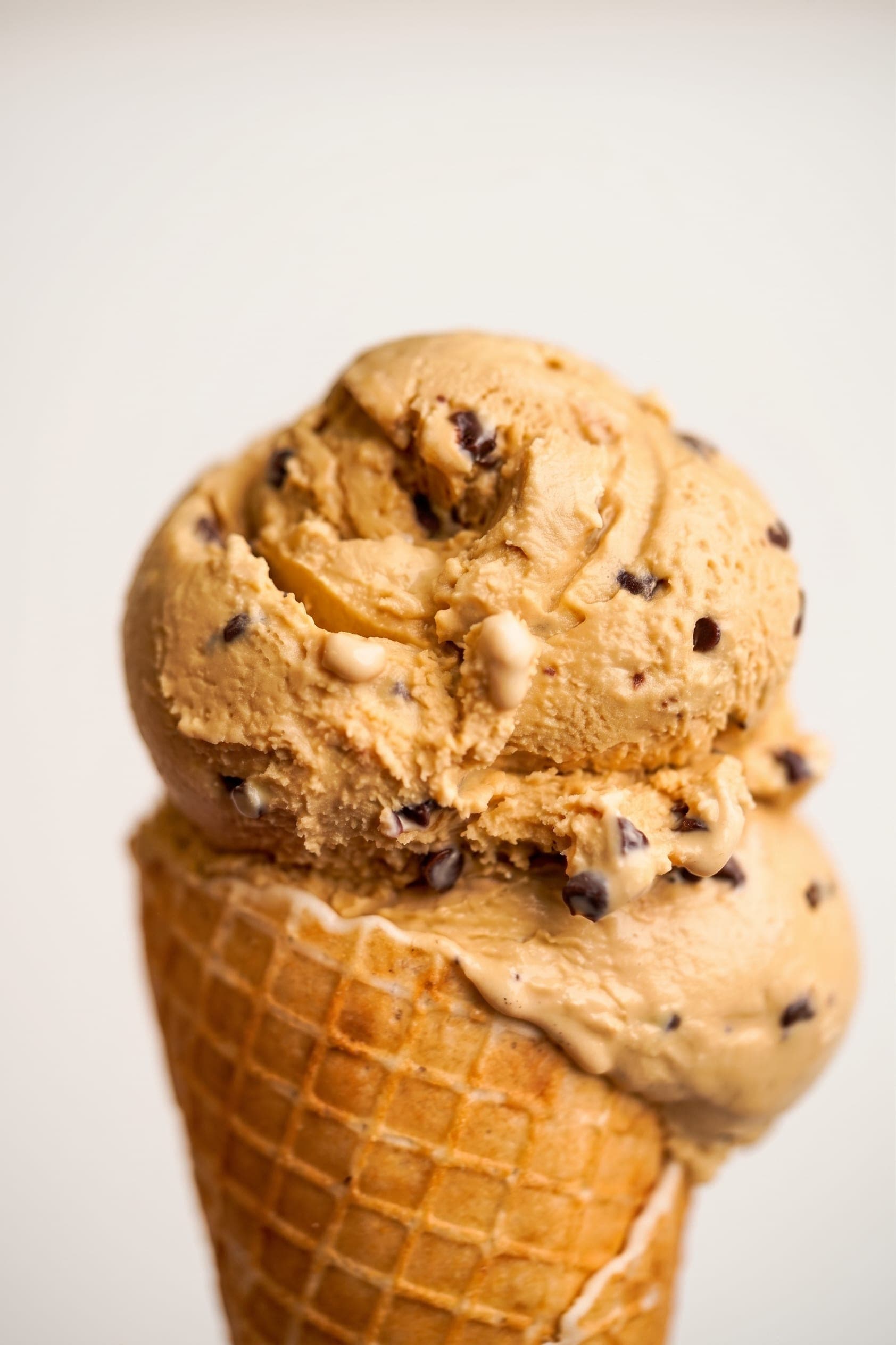Glacier ice cream scoops stacked in a waffle cone